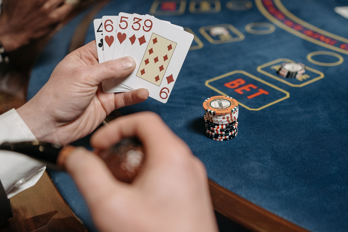 Close view of a hosted blackjack-style event table laid out with unmarked symbolic chips